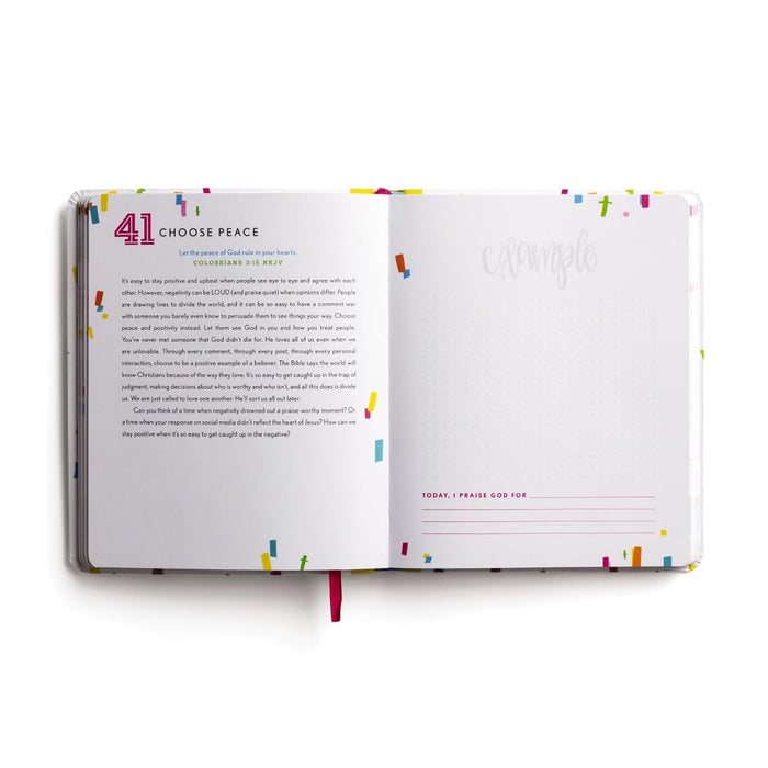 Open book with colorful text and design on a white background