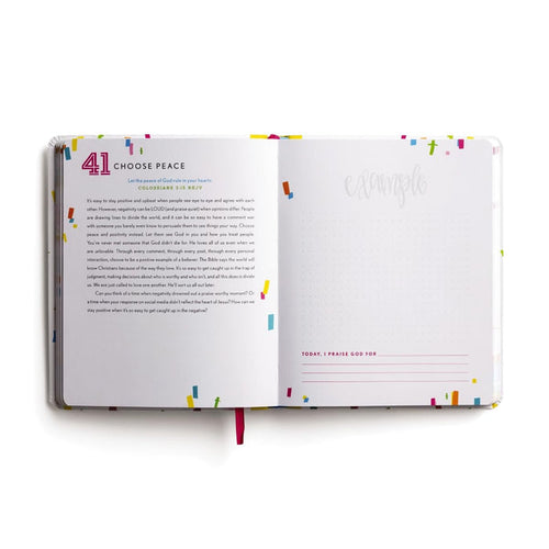 Open book with colorful text and design on a white background