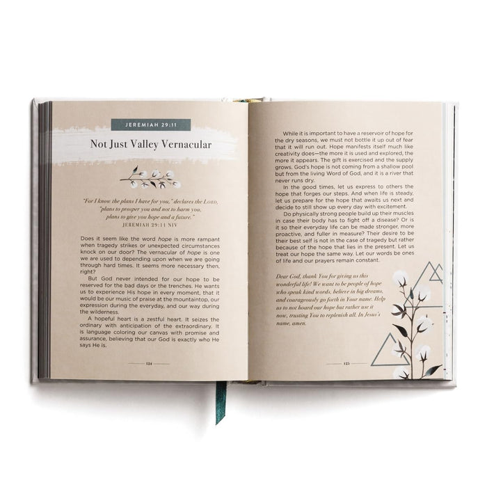 Open book with text and decorative elements on a white background