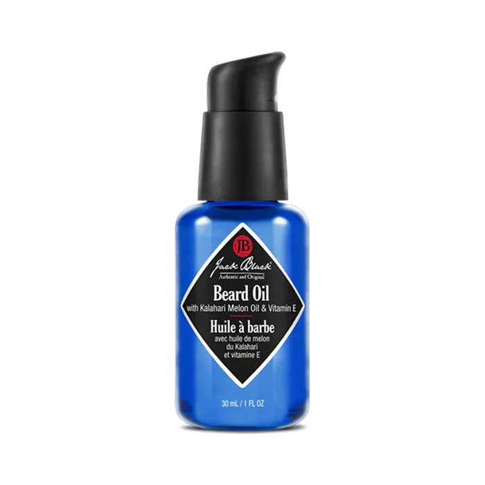 Blue bottle of Jack Black beard oil on a white background