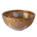 Ceramic bowl with brown and white speckled glaze on a white background