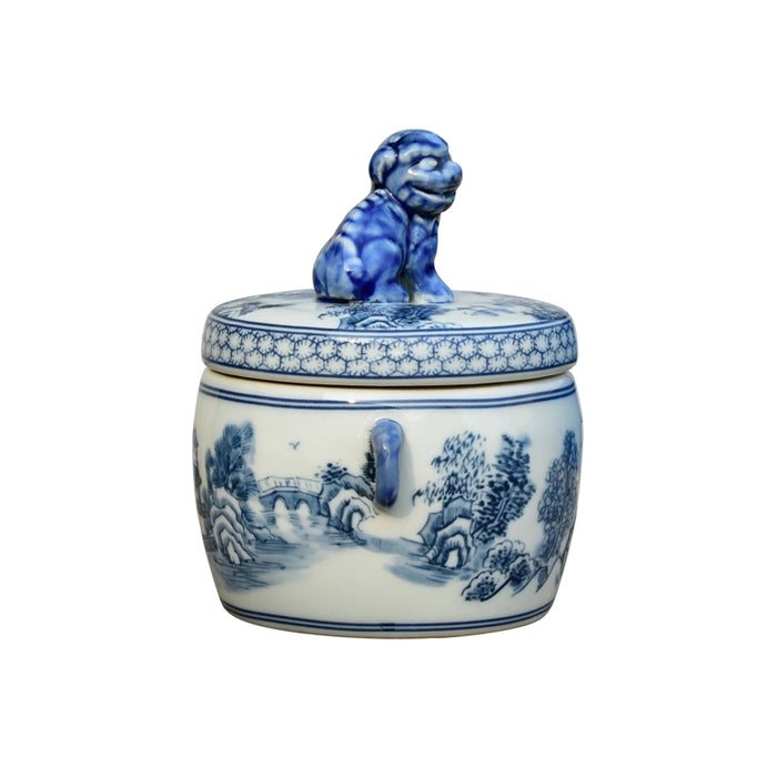 Blue and white ceramic jar with lid featuring a decorative design on a white background