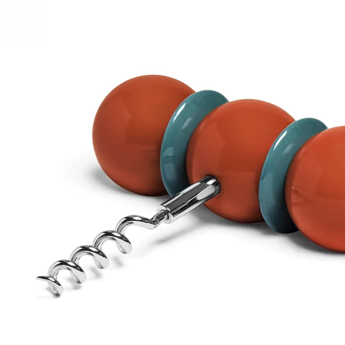 Corkscrew with orange and teal handles on a white background