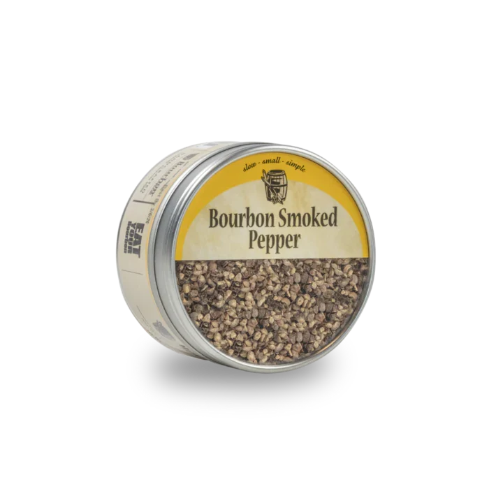 Tin of bourbon smoked pepper on a white background