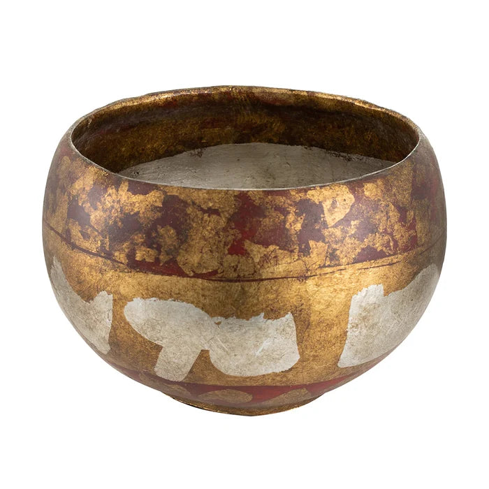 Decorative bowl with gold and red patterns on a white background