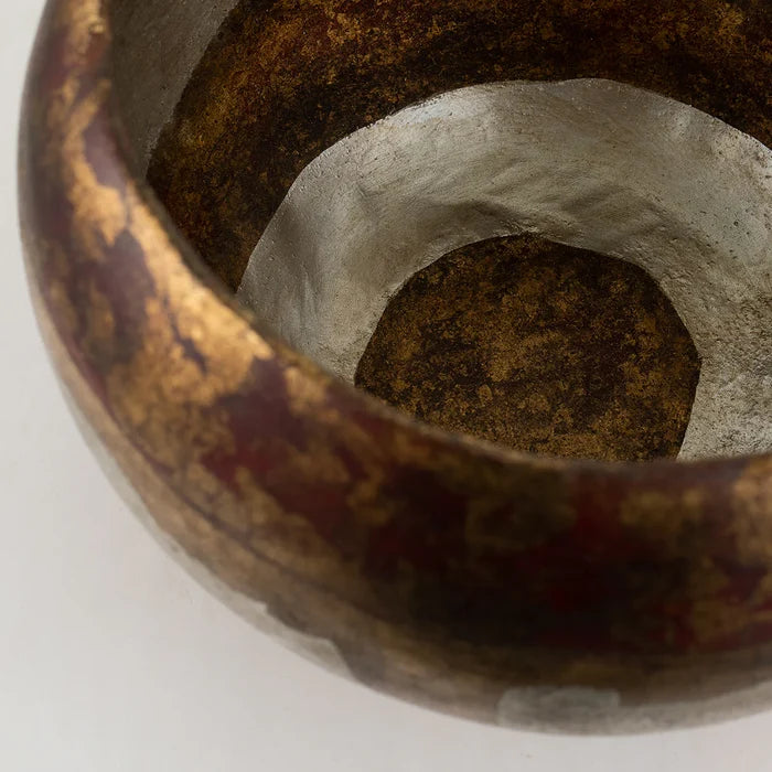 Close-up of a decorative bowl with a spiral pattern on a white background