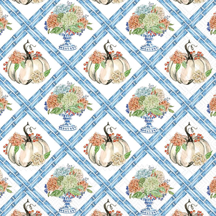 A repeating watercolor-style pattern featuring cream pumpkins with orange and red berries, blue floral bouquets in blue-and-white urns, and a blue lattice background.